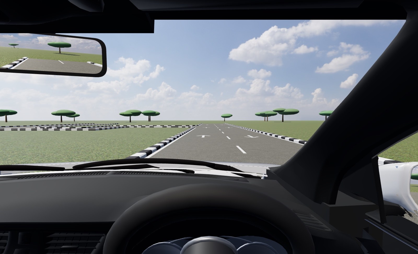 The driver's view in Drive Lab: through the windscreen of a learner car on the approach to the crank course, kerbs either side, mirror and steering wheel in frame.